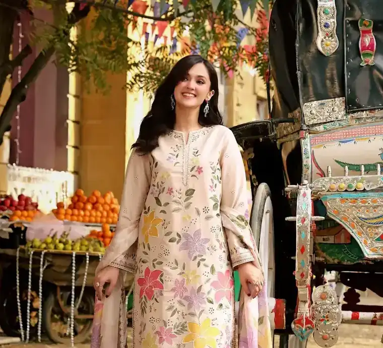 Woman wearing an embroidered linen suit — shop from Pakistan on Markaz